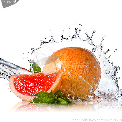Image of Water splash on grapefruit with mint isolated on white