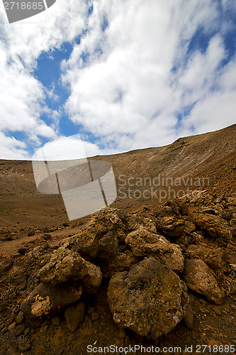 Image of stone  spain volcanic timanfaya  rock  sky  hill and summer 