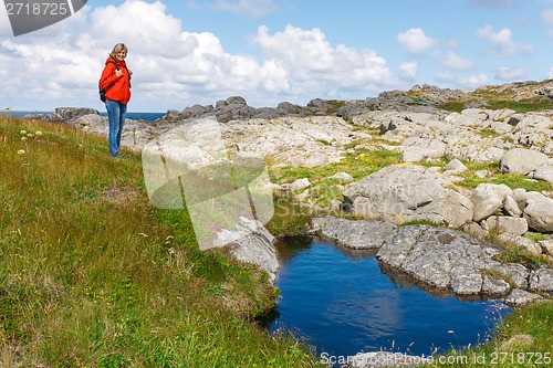 Image of Woman hiker on wild nature