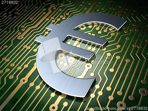 Image of Currency concept: Euro on circuit board background