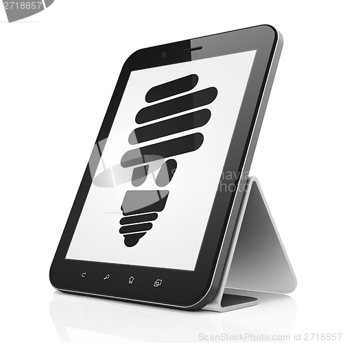 Image of Finance concept: Energy Saving Lamp on tablet pc computer