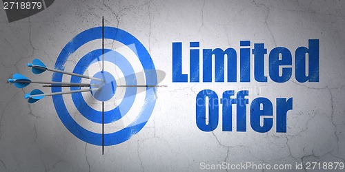 Image of Business concept: target and Limited Offer on wall background