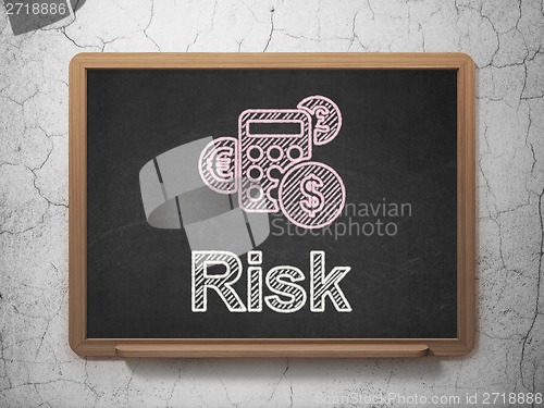 Image of Business concept: Calculator and Risk on chalkboard background