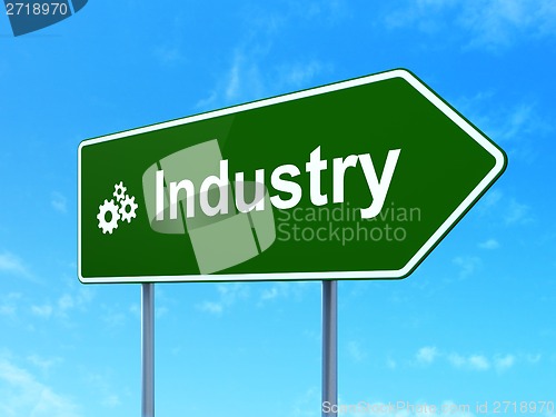 Image of Finance concept: Industry and Gears on road sign background