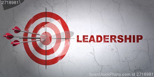 Image of Business concept: target and Leadership on wall background