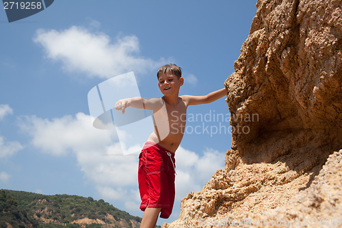 Image of Little boy climbing up