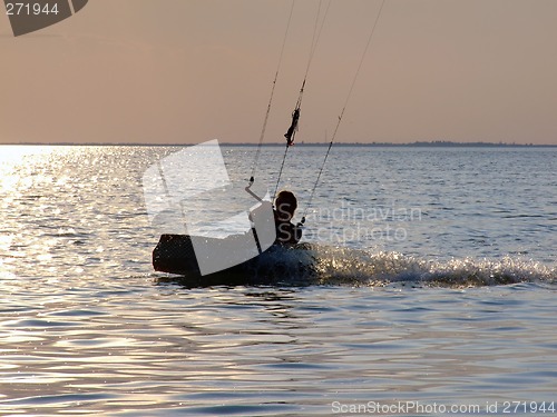 Image of Silhouettes kitesurf on a gulf on a sunset 2