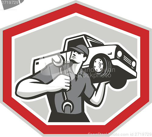 Image of Automotive Mechanic Carrying Pick-Up Truck