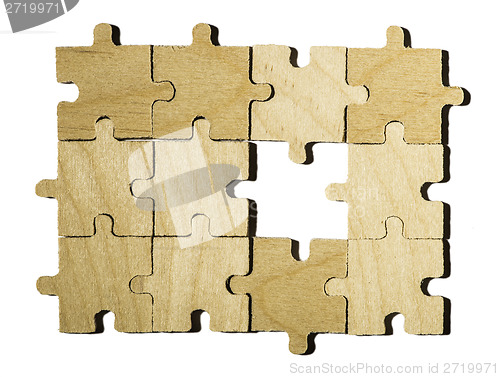 Image of Wooden puzzle on white background. 
