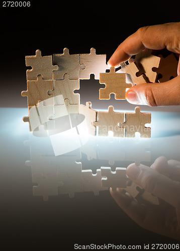 Image of Wooden puzzle and backlight background. Close up