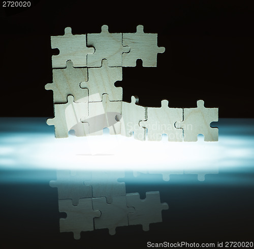 Image of Wooden puzzle and backlight background. Close up