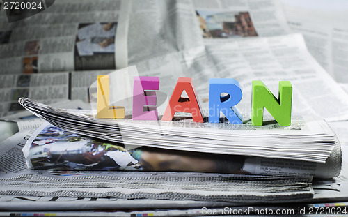 Image of Word learn on newspaper