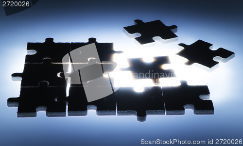 Image of Wooden puzzle and backlight background