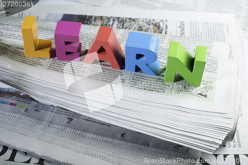 Image of Word learn on newspaper