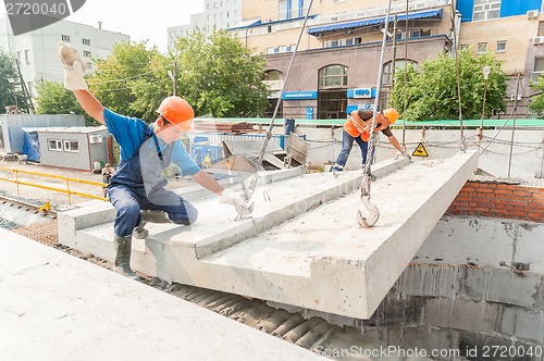 Image of Builders working on residental house construction