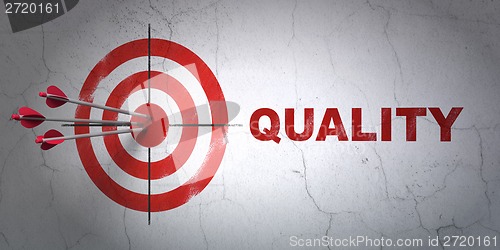 Image of Marketing concept: target and Quality on wall background