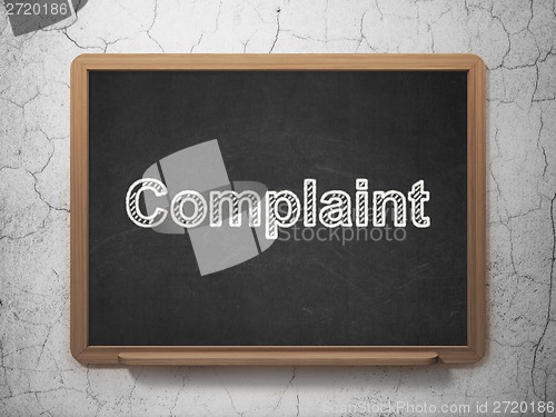 Image of Law concept: Complaint on chalkboard background