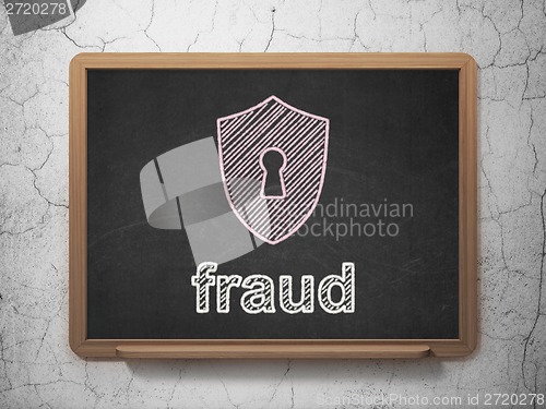 Image of Protection concept: Shield With Keyhole and Fraud on chalkboard background