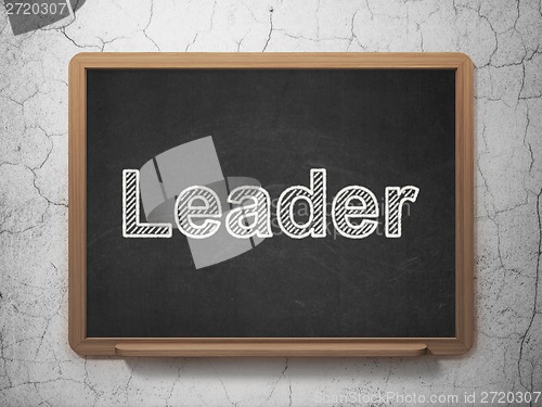 Image of Business concept: Leader on chalkboard background