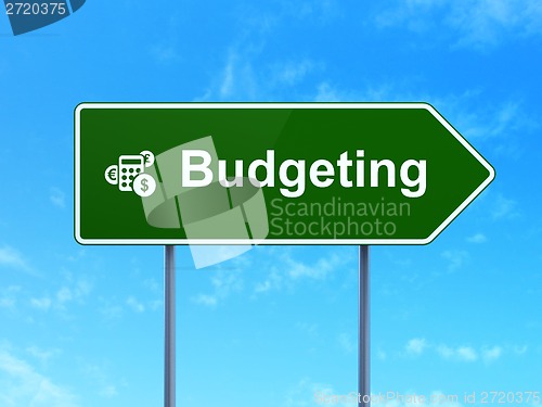 Image of Finance concept: Budgeting and Calculator on road sign background