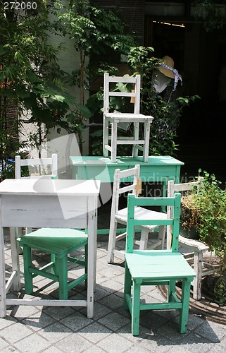 Image of Pile of tables and chairs