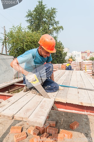 Image of Builders working on residental house construction