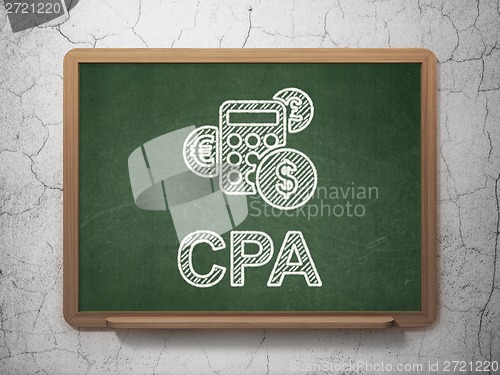 Image of Finance concept: Calculator and CPA on chalkboard background