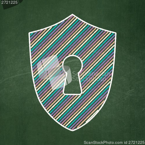 Image of Safety concept: Shield With Keyhole on chalkboard background