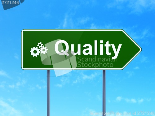 Image of Advertising concept: Quality and Gears on road sign background