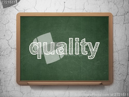 Image of Advertising concept: Quality on chalkboard background