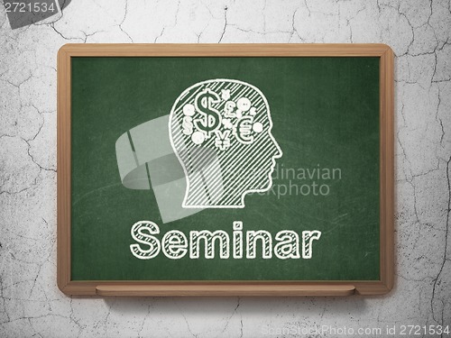 Image of Education concept: Head With Finance Symbol and Seminar on chalkboard background