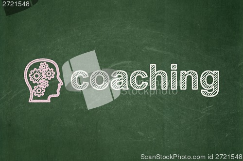 Image of Education concept: Head With Gears and Coaching on chalkboard background