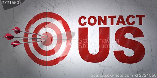 Image of Marketing concept: target and Contact Us on wall background