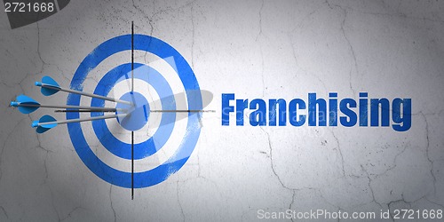 Image of Business concept: target and Franchising on wall background