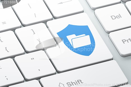 Image of Finance concept: Folder With Shield on computer keyboard background