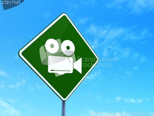 Image of Travel concept: Camera on road sign background