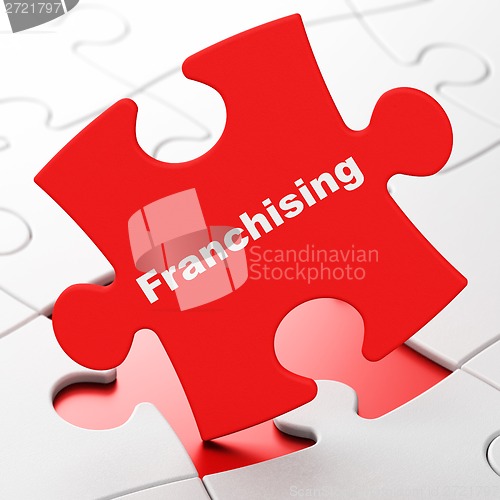 Image of Finance concept: Franchising on puzzle background