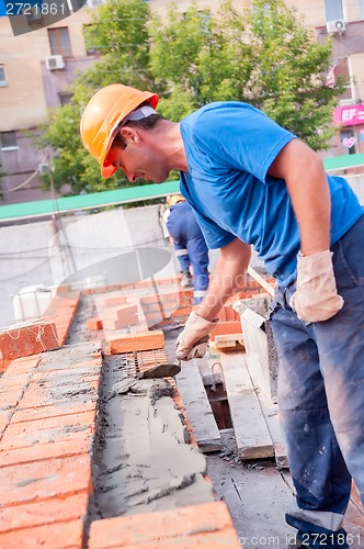 Image of Bricklayer on house construction