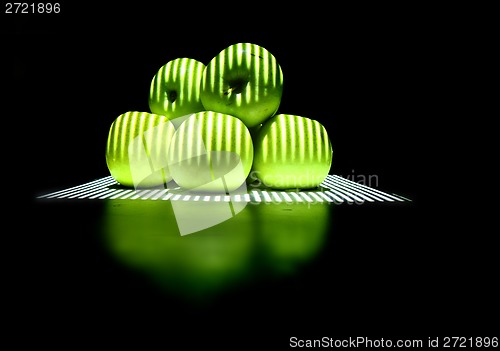 Image of green apples in the dark night 