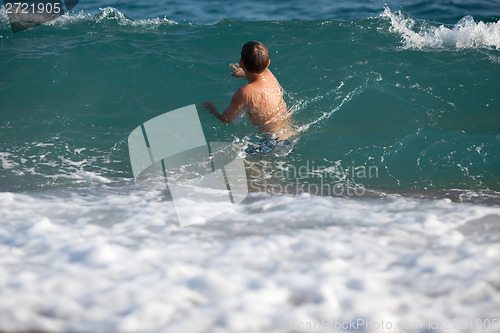 Image of Little boy in the sea