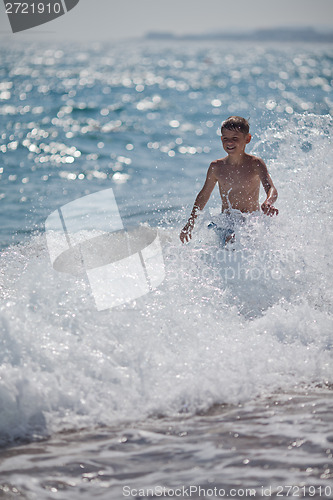 Image of Happy little boy and sea