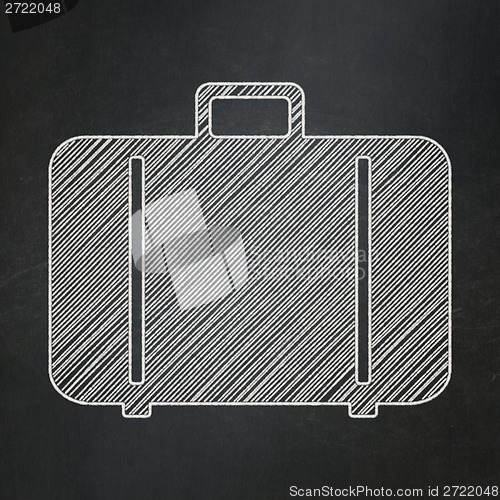 Image of Vacation concept: Bag on chalkboard background