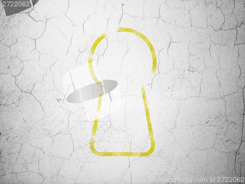 Image of Security concept: Keyhole on wall background