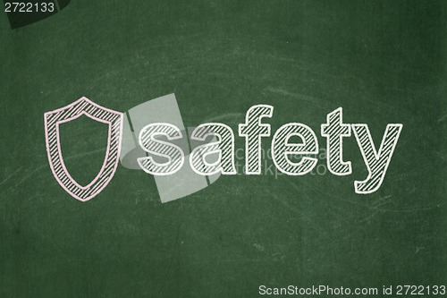 Image of Security concept: Contoured Shield and Safety on chalkboard background