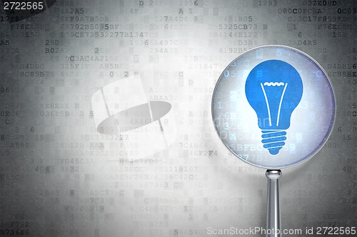 Image of Business concept:  Light Bulb with optical glass on digital background