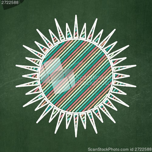 Image of Vacation concept: Sun on chalkboard background