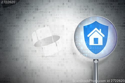 Image of Business concept:  Shield with optical glass on digital background