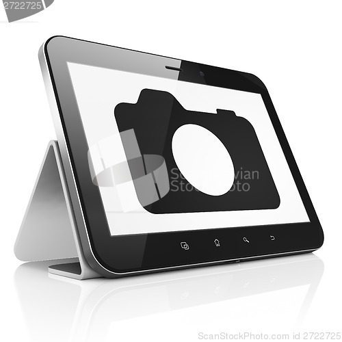 Image of Vacation concept: Photo Camera on tablet pc computer