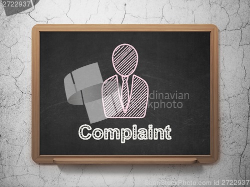 Image of Law concept: Business Man and Complaint on chalkboard background