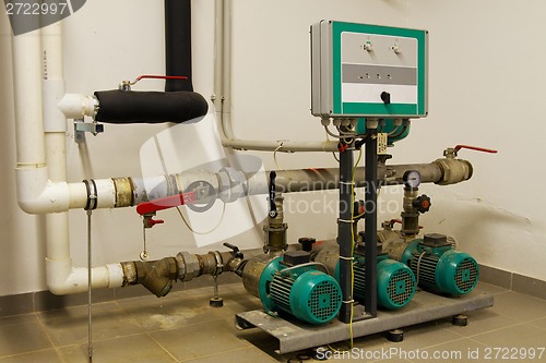 Image of Water pipes in the boiler room and electric motors